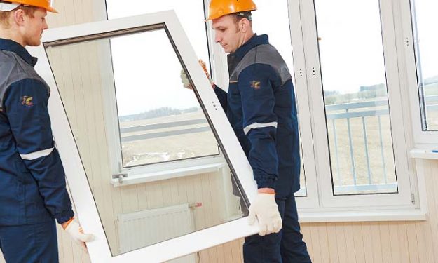 JC Construction workers installing windows